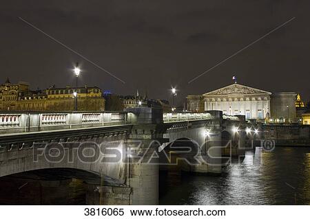 Stock Photography - France, Paris, Concorde Bridge and Palais Bourbon (National Assembly), at night.. Fotosearch