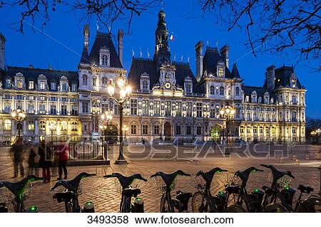 France, Paris, Hotel de ville (city hall) at night, shared bikes in the foreground View Large Photo Image Stock Photo - France, Paris, Hotel de ville (city hall) at night, shared bikes in the foreground. Fotosearch
