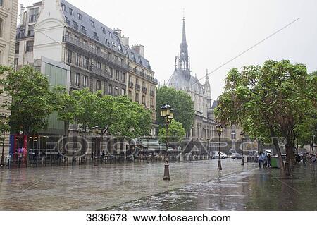 Stock Photo - France, Paris, ile de la Cite, Lutece street in the rain.. Fotosearch