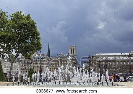 Stock Photo - France, Paris, Place de l'Hotel de Ville, water jets of the fountain.. Fotosearch
