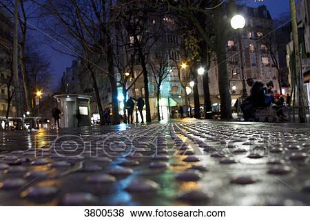 France, Paris, Place des Grandes Rigolles at night, in the rain. View Large Photo Image Stock Photo - France, Paris, Place des Grandes Rigolles at night, in the rain.. Fotosearch