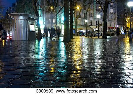France, Paris, Place des Grandes Rigolles, at night, in the rain. View Large Photo Image Stock Photo - France, Paris, Place des Grandes Rigolles, at night, in the rain.. Fotosearch