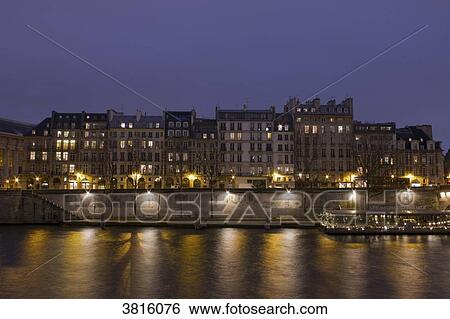 Stock Photograph - France, Paris, Quai de l'Horloge at night.. Fotosearch