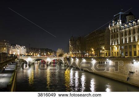 Stock Photo - France, Paris, the Seine, Saint-Michel Bridge, at night.. Fotosearch