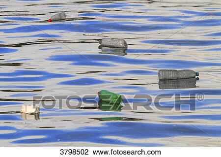 France, plastic bottle floating on water View Large Photo Image Stock Image - France, plastic bottle floating on water. Fotosearch