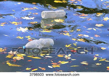 France, plastic bottle floating on water View Large Photo Image Stock Image - France, plastic bottle floating on water. Fotosearch