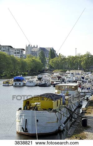 France, region of Pays de La Loire, Loire-Atlantique department, Nantes city, boats moored on canal of Saint-Felix, Cathedral of St. Peter and St. Paul in the back. View Large Photo Image Stock Image - France, region of Pays de La Loire, Loire-Atlantique department, Nantes city, boats moored on canal of Saint-Felix, Cathedral of St. Peter and St. Paul in the back.. Fotosearch