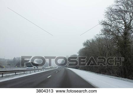 Stock Image - France, road in the country covered with frost.. Fotosearch