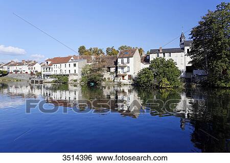 France, Seine and Marne. Nemours. City center. The Loing river in the foreground. View Large Photo Image Stock Photograph - France, Seine and Marne. Nemours. City center. The Loing river in the foreground.. Fotosearch