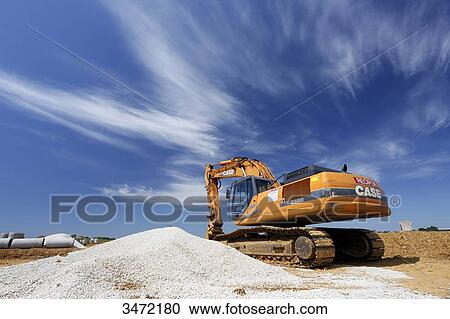 Stock Image - France, Seine-et-Marne. New town of Chessy (Serris-Montevrain-Marne la Vallee). Construction site (houses, offices). Excavator.. Fotosearch