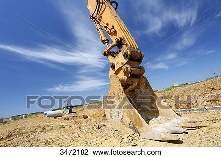 France, Seine-et-Marne. New town of Chessy (Serris-Montevrain-Marne la Vallee). Construction site (houses, offices). Excavator. View Large Photo Image Stock Image - France, Seine-et-Marne. New town of Chessy (Serris-Montevrain-Marne la Vallee). Construction site (houses, offices). Excavator.. Fotosearch
