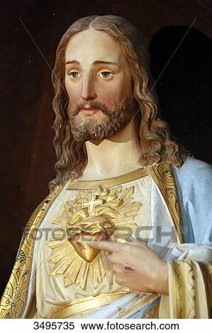 Stock Photography - France, Seine et Marne. Provins, medieval city, Saint-Quiriace collegiate. Close up of the statue of Christ.. Fotosearch