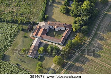 Stock Image - France, Southern France, aerial view of the countryside from Villefranche du Queyran. Large house in the center and its turret. Fotosearch