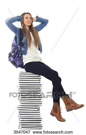 France, teenager in studio on books View Large Photo Image Stock Photo - France, teenager in studio on books. Fotosearch