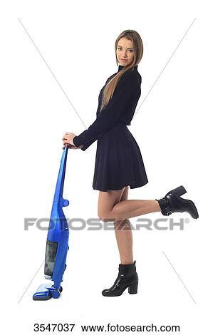 France, teenager in studio with a vacuum cleaner View Large Photo Image Stock Photo - France, teenager in studio with a vacuum cleaner. Fotosearch