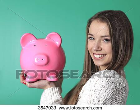 France, teenager in studio with money box View Large Photo Image Stock Image - France, teenager in studio with money box. Fotosearch