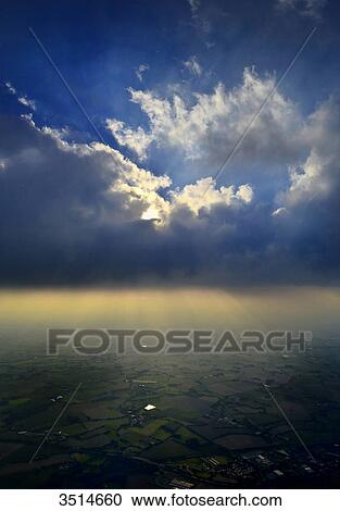 France, Western France, aerial and vertical view of the Vendee countryside. Imposing cloud and play of light against the light View Large Photo Image Stock Image - France, Western France, aerial and vertical view of the Vendee countryside. Imposing cloud and play of light against the light. Fotosearch