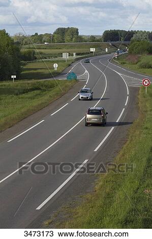 Stock Image - France, Western France, Arthon-en-Retz, traffic on D 751 road. Fotosearch