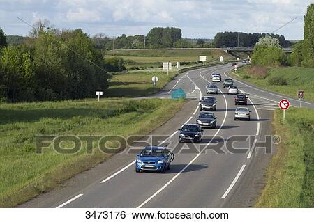 Stock Photograph - France, Western France, Arthon-en-Retz, traffic on D 751 road. Fotosearch