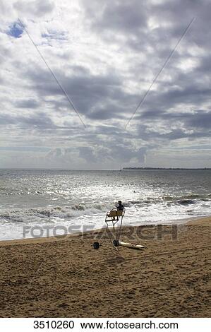 France, Western France, La Baule, lifeguard on deserted beach, in gloomy weather, 2014. View Large Photo Image Stock Image - France, Western France, La Baule, lifeguard on deserted beach, in gloomy weather, 2014.. Fotosearch