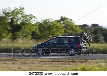 Stock Image - France, Western France, Les Moutiers-en-Retz, traffic on D13 road (the blue road). Fotosearch