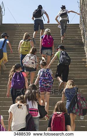 Stock Photo - France, Western France, Nantes, Chateau des Ducs, middle schoolers climbing up stairs. Fotosearch
