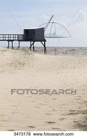 Stock Photo - France, Western France, Moutiers-in-Retz, fishery behind the dune.. Fotosearch