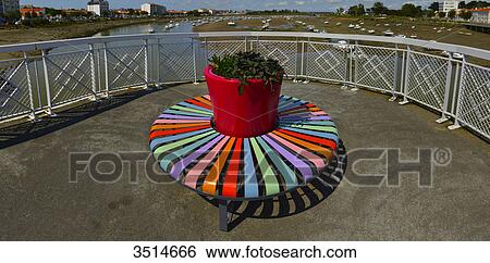 France, Western France, terrace and colorful circular bench in front of the port of St. Gilles Croix de Vie View Large Photo Image Stock Photograph - France, Western France, terrace and colorful circular bench in front of the port of St. Gilles Croix de Vie. Fotosearch