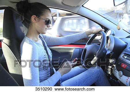 France, woman driving and using smartphone View Large Photo Image Stock Image - France, woman driving and using smartphone. Fotosearch