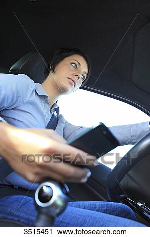 France, woman in car with phone View Large Photo Image Stock Image - France, woman in car with phone. Fotosearch
