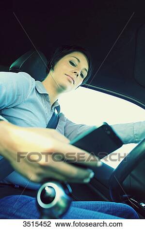 France, woman in car with phone View Large Photo Image Stock Image - France, woman in car with phone. Fotosearch