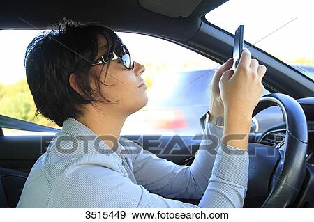France, woman in car with phone View Large Photo Image Stock Photo - France, woman in car with phone. Fotosearch