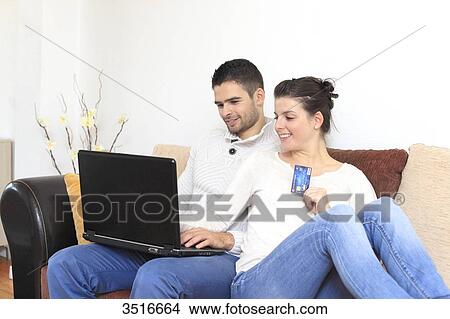 France, young couple at home, online shopping View Large Photo Image Picture - France, young couple at home, online shopping. Fotosearch