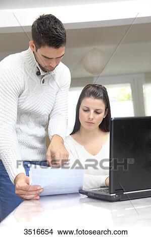 Picture - France, young couple at home. Fotosearch