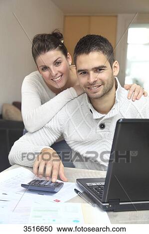 Stock Image - France, young couple at home. Fotosearch