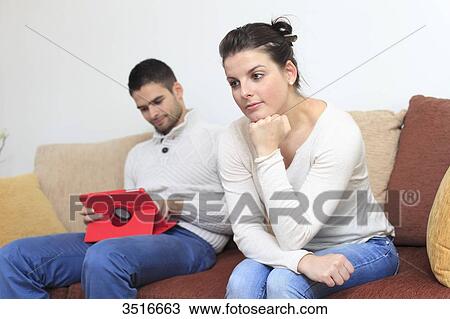 Stock Image - France, young couple at home. Fotosearch