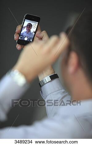 France, young man taking selfie View Large Photo Image Picture - France, young man taking selfie. Fotosearch