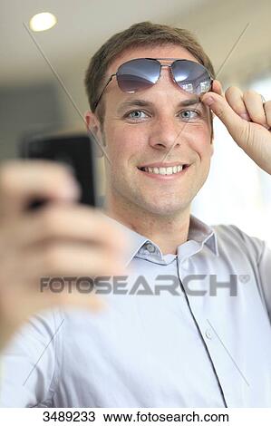 France, young man taking selfie View Large Photo Image Stock Image - France, young man taking selfie. Fotosearch