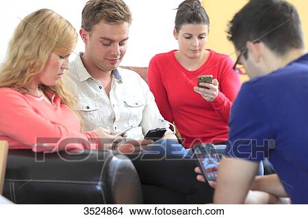 France, young people on telephone in the living room View Large Photo Image Picture - France, young people on telephone in the living room. Fotosearch