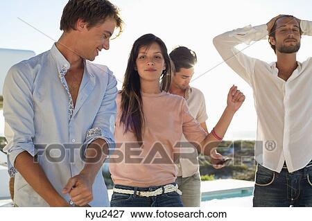 Stock Photo - Friends enjoying dance in a party. Fotosearch