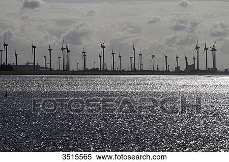 Stock Photography - Germany. Lower Saxony. Emden. The Ems. Field of windmills.. Fotosearch