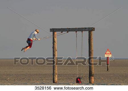 Germany, Nordfriesland, Schleswig-Holstein, Sankt Peter Ording or St Peter Ording is the biggest seaside resort in Germany. View Large Photo Image Stock Photograph - Germany, Nordfriesland, Schleswig-Holstein, Sankt Peter Ording or St Peter Ording is the biggest seaside resort in Germany.. Fotosearch