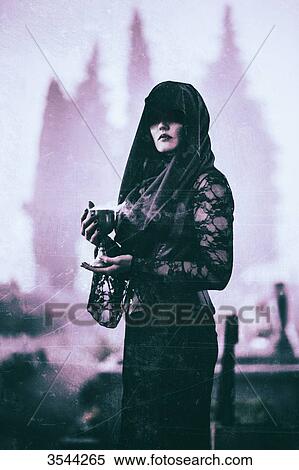 Gothic woman poses in a cemetery View Large Photo Image Stock Photography - Gothic woman poses in a cemetery. Fotosearch