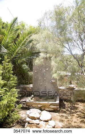 Picture - Greece, Cyclades, outdoor shower in the garden. Fotosearch