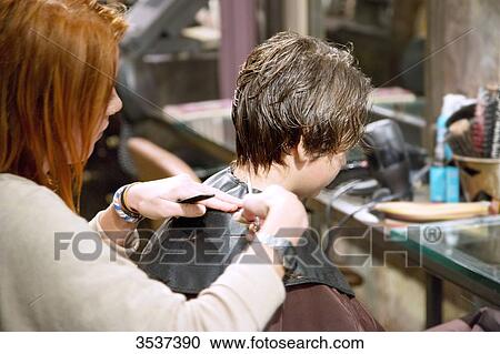 Hairdresser doing haircut View Large Photo Image Stock Image - Hairdresser doing haircut. Fotosearch