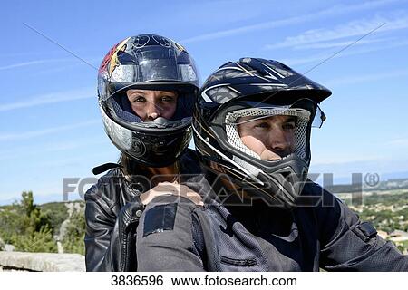 Happy young biker couple riding motorbike in summer. View Large Photo Image Stock Photograph - Happy young biker couple riding motorbike in summer.. Fotosearch