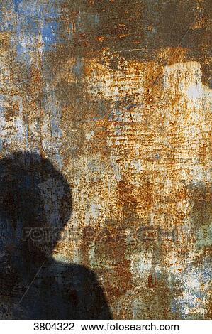 Human shadow on a rusty metal plate. View Large Photo Image Stock Image - Human shadow on a rusty metal plate.. Fotosearch