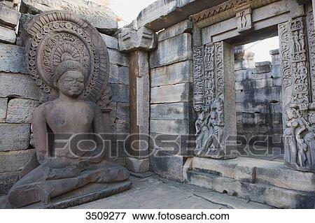 India, Madhya Pradesh, Sanchi, Buddha statue and portal; Temple 45 View Large Photo Image Stock Photo - India, Madhya Pradesh, Sanchi, Buddha statue and portal; Temple 45. Fotosearch