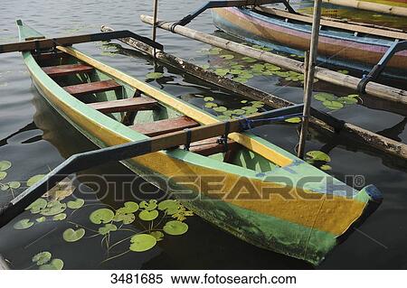 Indonesia, Bali, Bedugul, outrigger canoe on lake Bratan near the temple of Ulun Danu View Large Photo Image Stock Photography - Indonesia, Bali, Bedugul, outrigger canoe on lake Bratan near the temple of Ulun Danu. Fotosearch