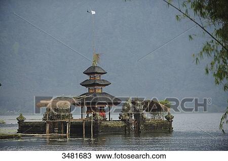 Indonesia, Bali, Bedugul, the temple of Ulun Danu is located on the shores of Lake Bratan. The Temple with its Atap Meru (bunk roofs) of 11 roofs is dedicated to the goddess of waters View Large Photo Image Stock Image - Indonesia, Bali, Bedugul, the temple of Ulun Danu is located on the shores of Lake Bratan. The Temple with its Atap Meru (bunk roofs) of 11 roofs is dedicated to the goddess of waters. Fotosearch